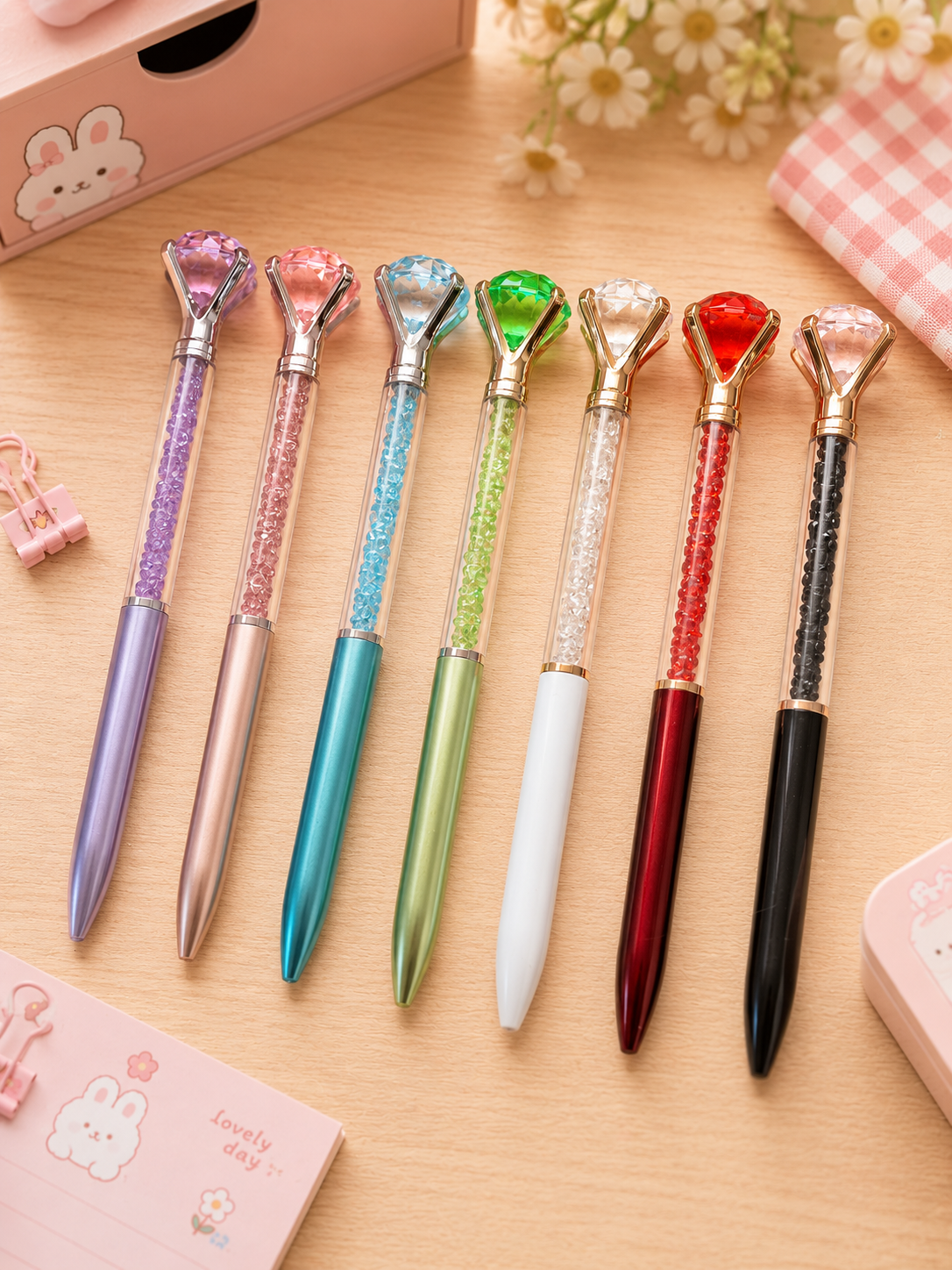 7 stylos diamant cristal scintillants en 7 coloris : violet, rose, transparent, bleu turquoise, vert, rouge et noir