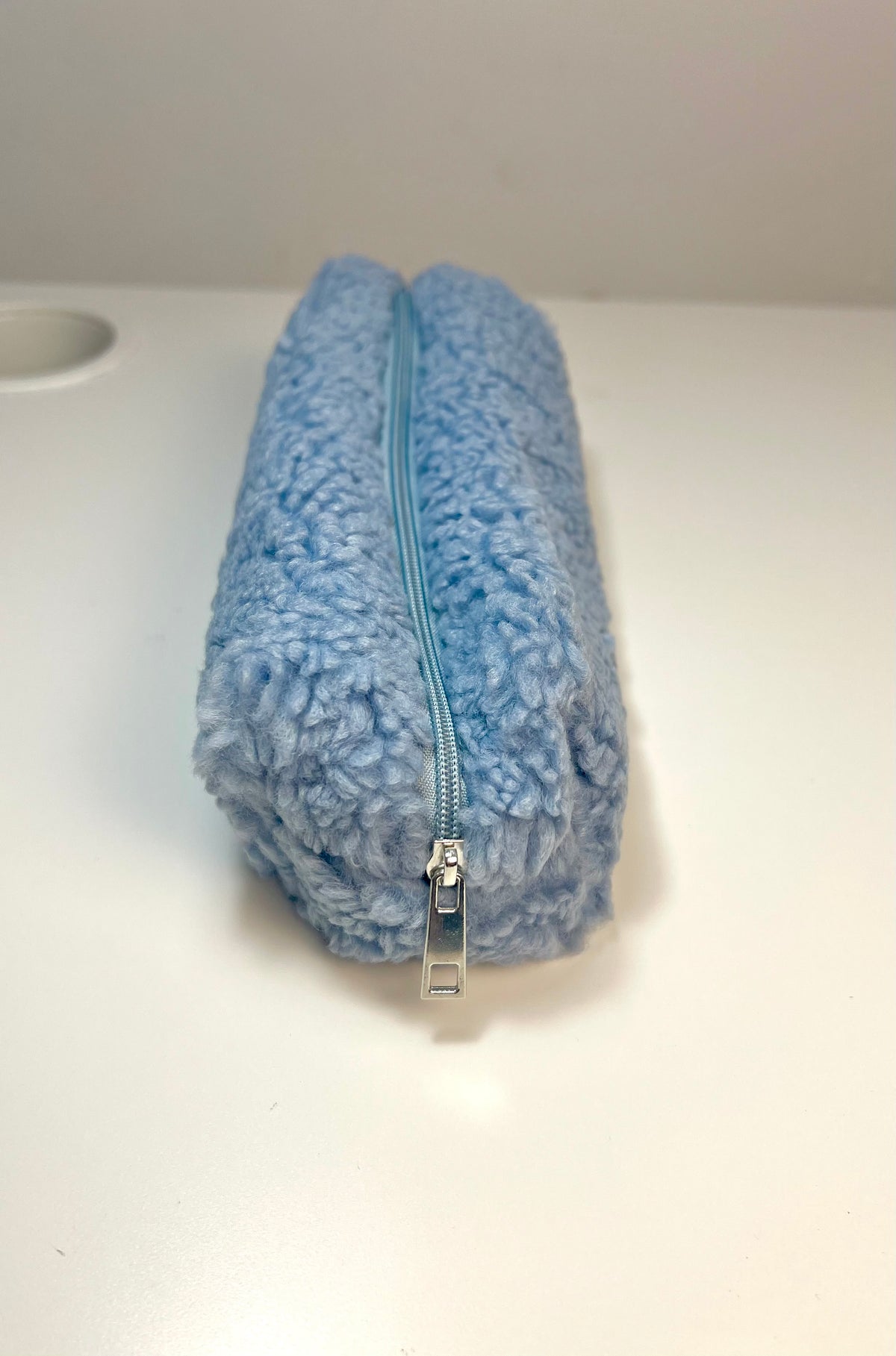 Trousse en peluche laineuse